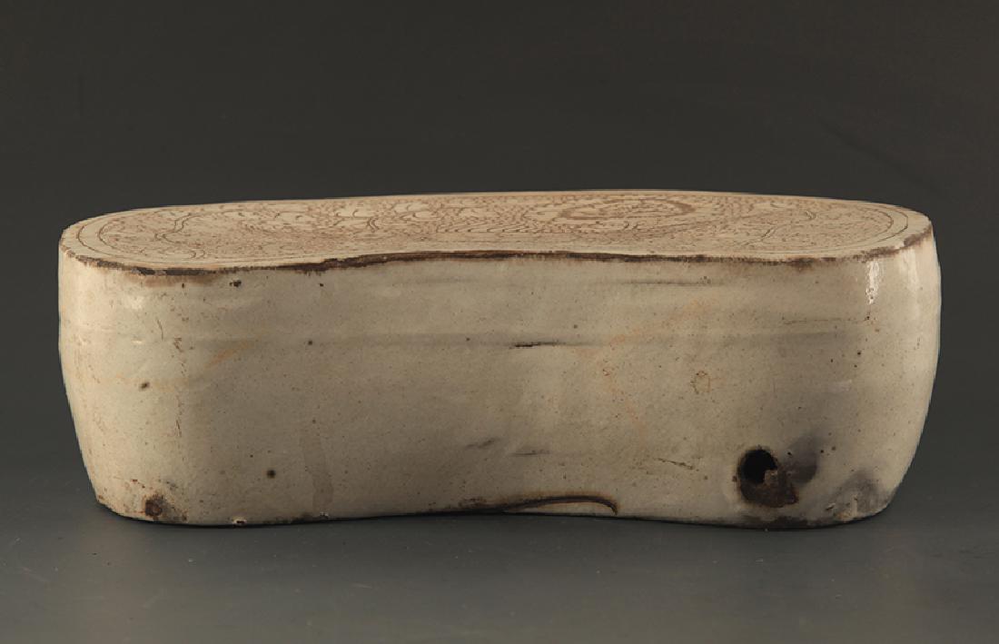 A CI ZHOU YAO PEARL GROUND PORCELAIN PILLOW: Song Dynasty, High: 3.25 inch; Long: 10.25 inch; Width: 5.25 inch