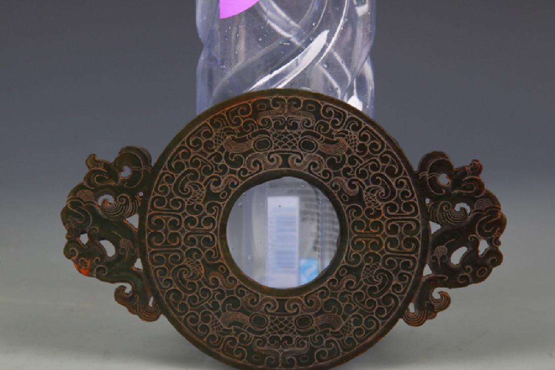 A WARRING STATES PERIOD STYLE DRAGON FIGURE JADE (1 of 4)