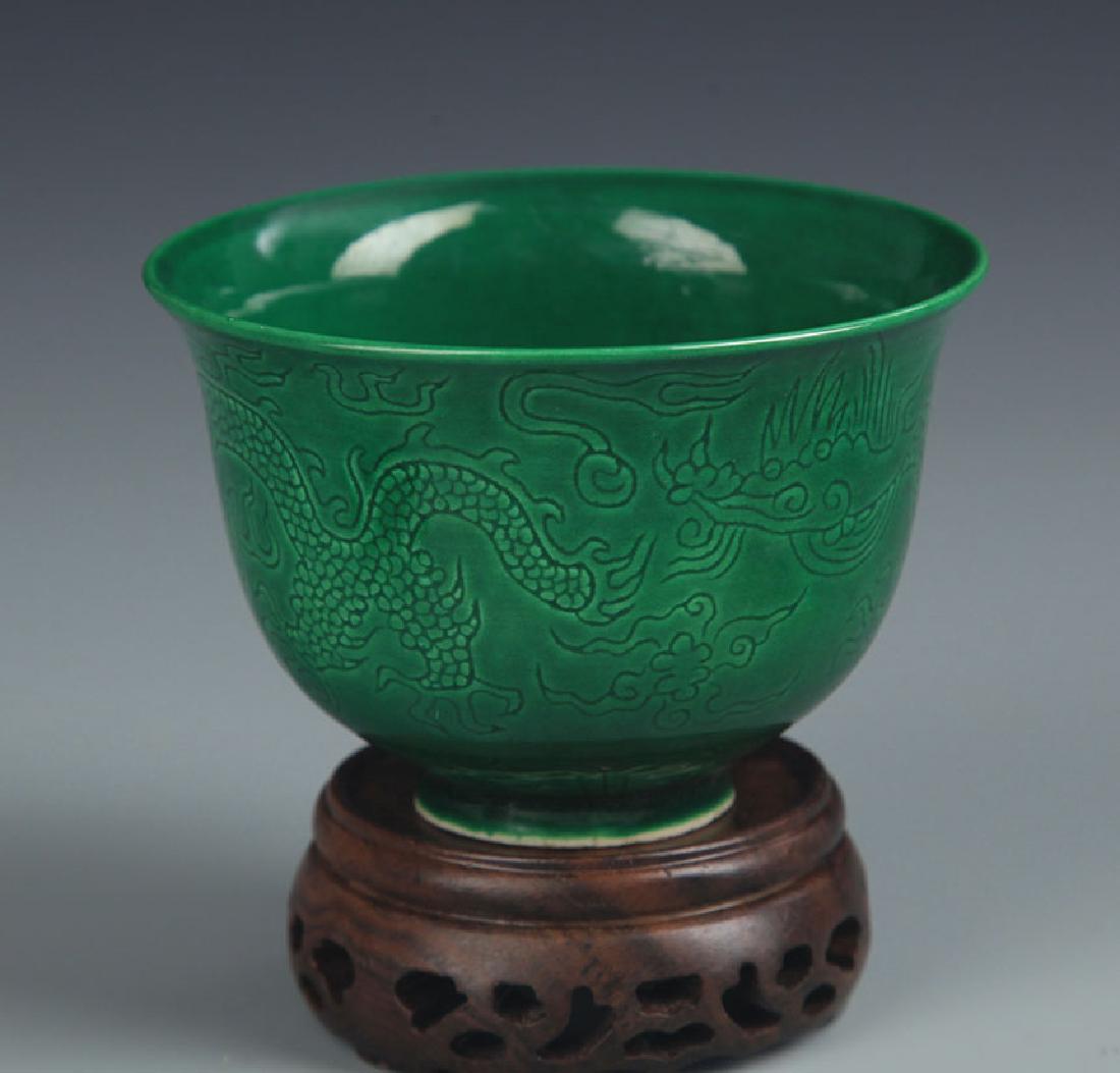 A GREEN COLOR DRAGON CARVING CUP: Ming Dynasty, High: 2.5 inch; Diameter:3.5 inch