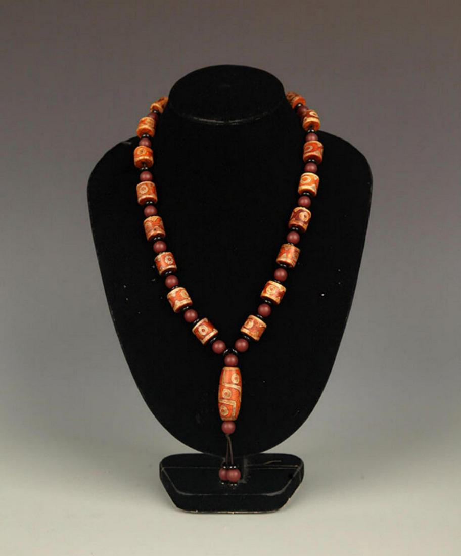 A FINE TIBETAN "THREE EYES" TIAN ZHU NECKLACE (1 of 5)