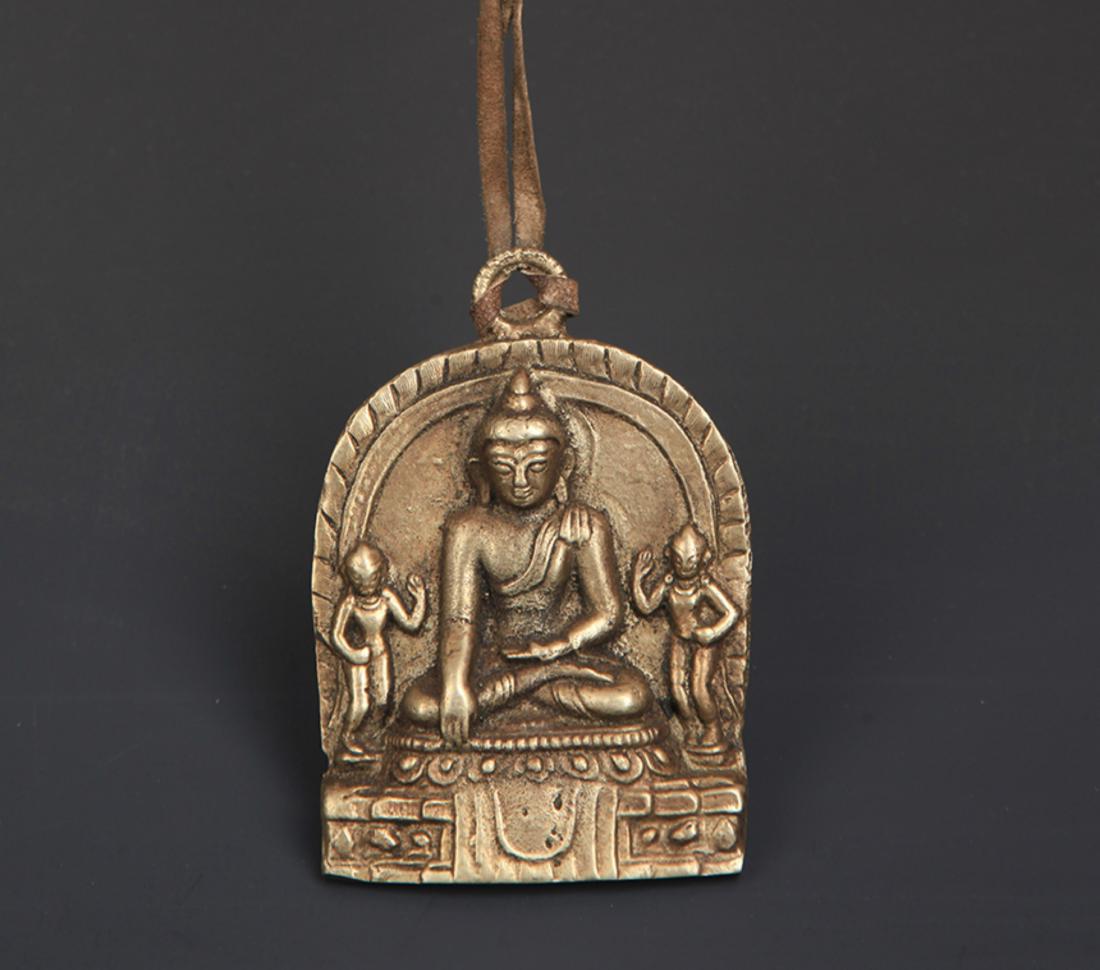A SMALL BRONZE SHAKYAMUNI BUDDHA PENDANT (1 of 3)