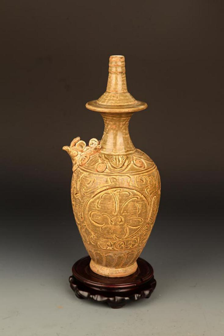 A YAO ZHOU YAO FLOWER CARVING WATER BOTTLE: Song Dynasty, High: 12.25 inch; Width: 5.0 inch