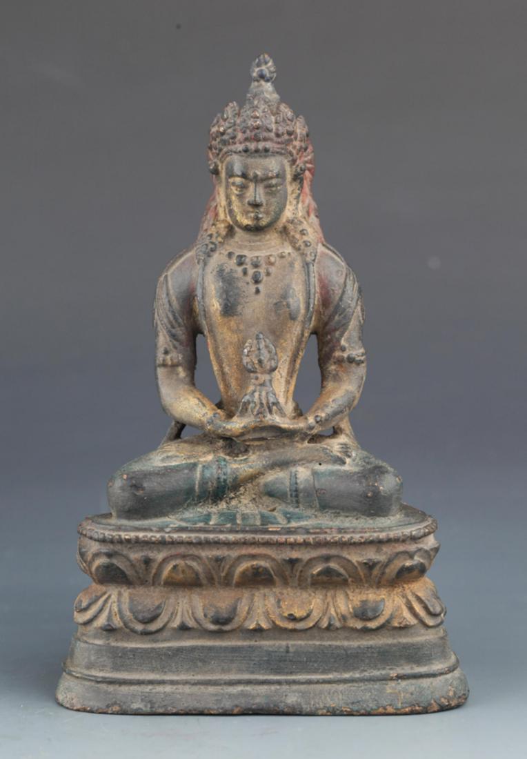 A BRONZE FIGURE OF SEATED DEITY (1 of 4)