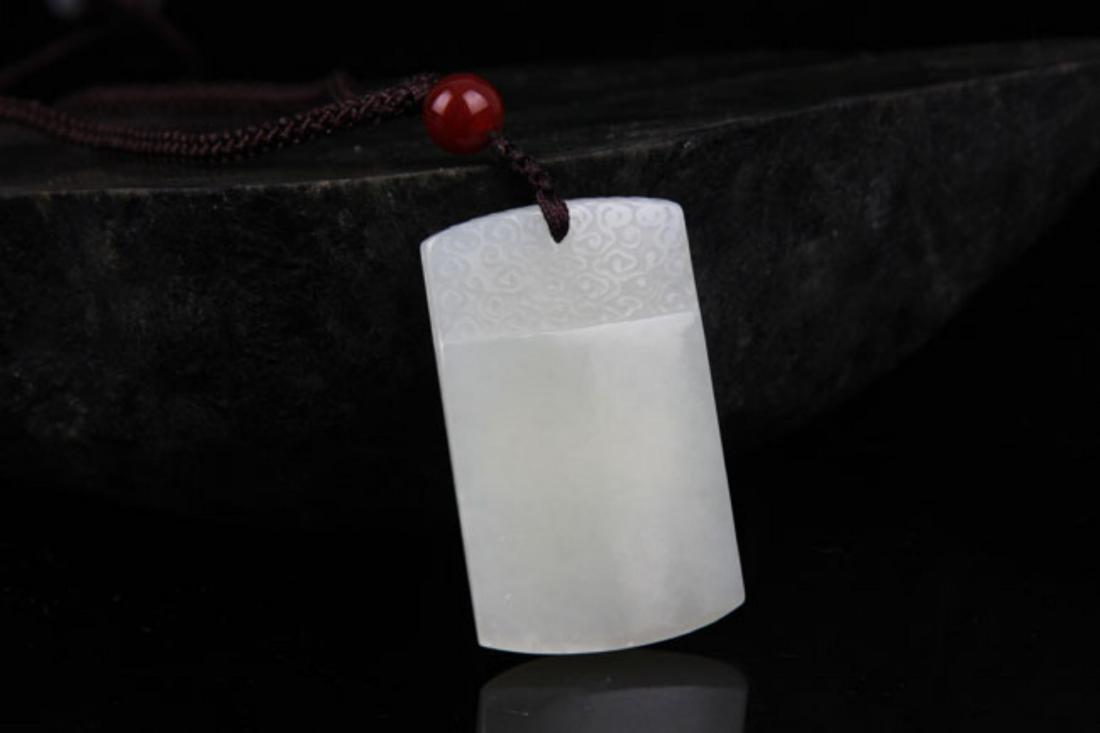 A FINE HETIAN GREENISH WHITE JADE PLAQUE (1 of 3)