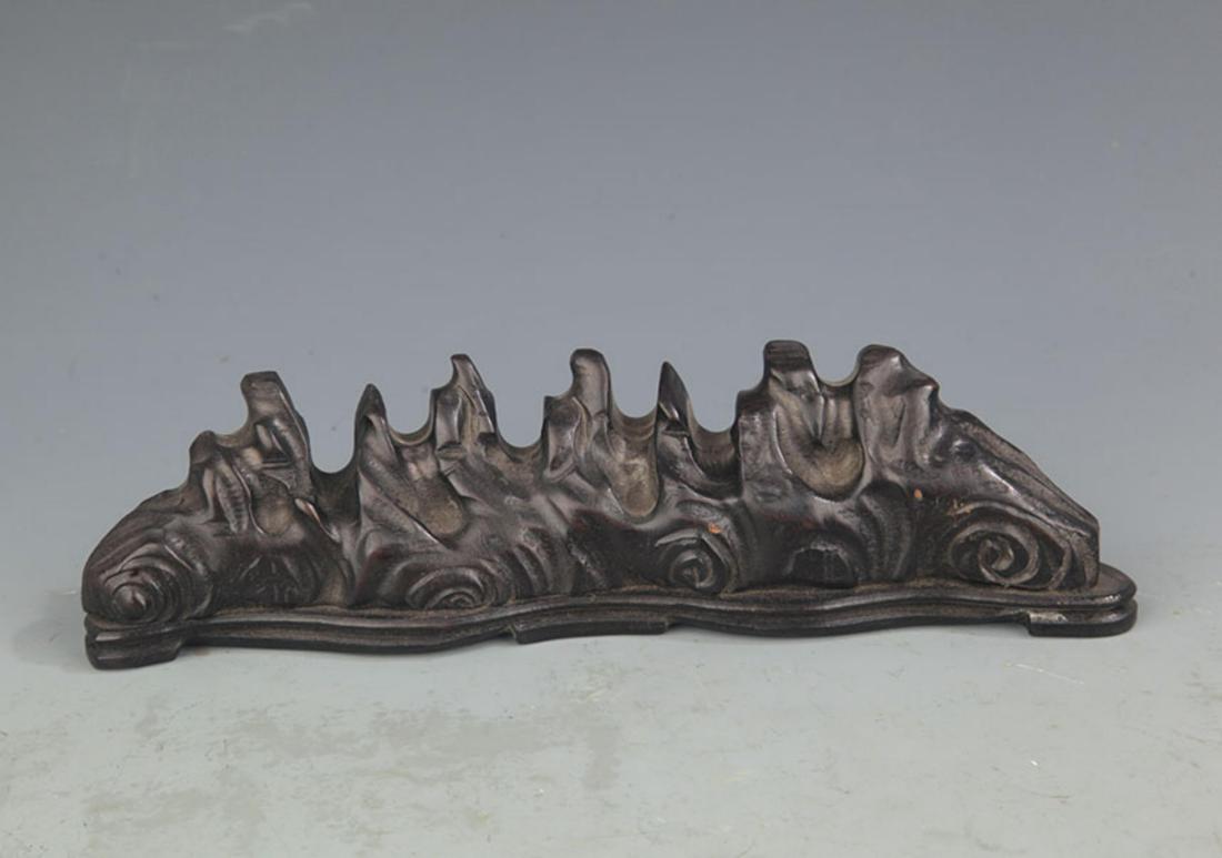 A SANDALWOOD MOUNTAIN FIGURE BRUSH RACK: 20th Century, High: 2.75 inch; Long: 10.00 inch