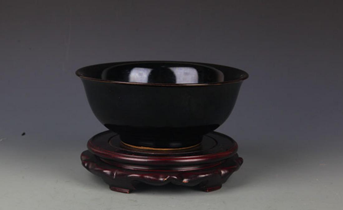 A BLACK COLOR GLAZED PORCELAIN BOWL: Ming Dynasty, High: 3.0 inch; Diameter: 7.5 inch