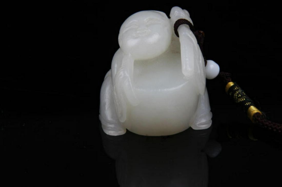 A FINE HETIAN JADE IN FIGURE OF BOY PLAYING (1 of 5)