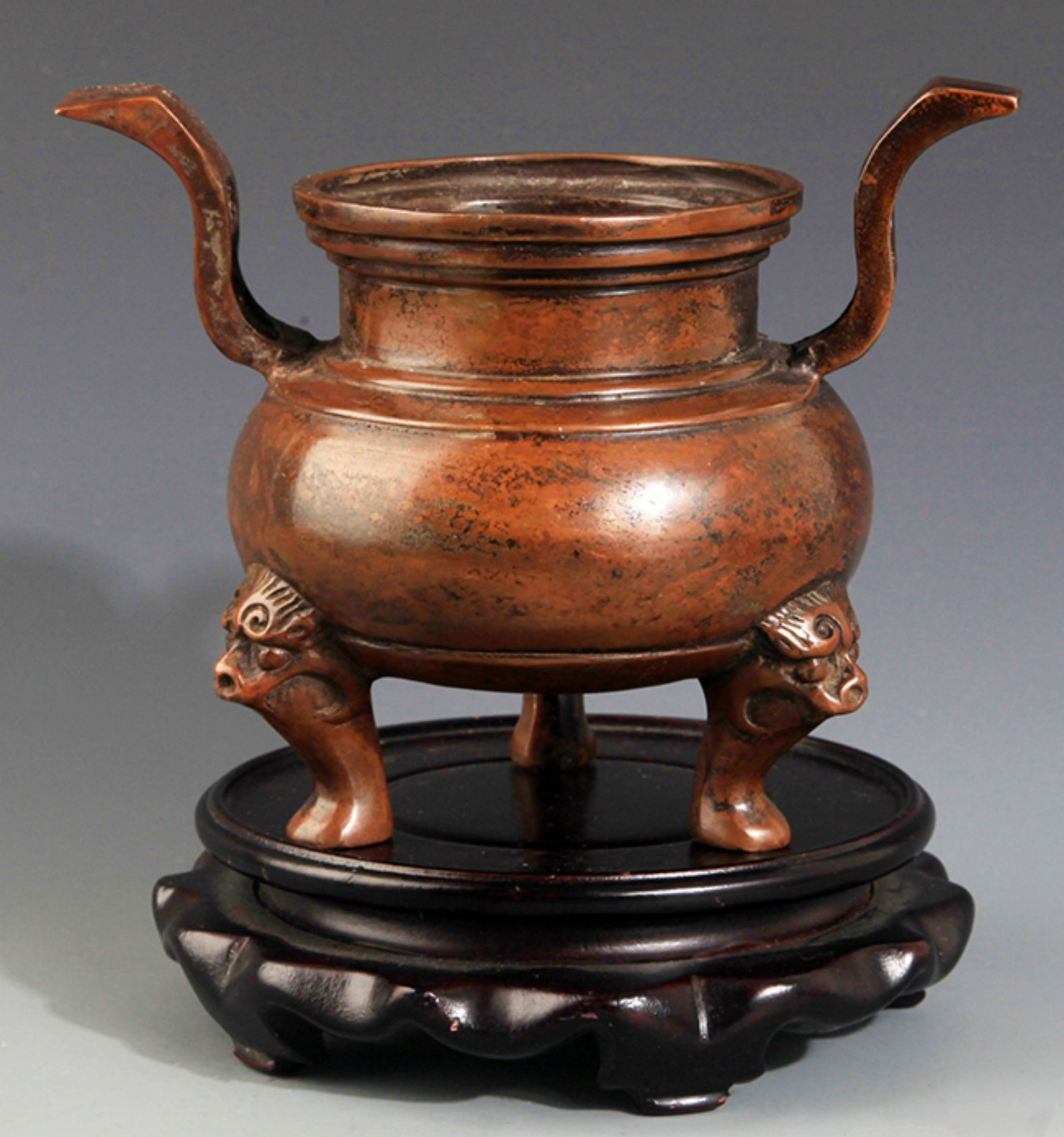 A DOUBLE EAR HIGH FOOT BRONZE CENSER: Ming Dynasty, High: 4.5 inch; Width: 6.5 inch