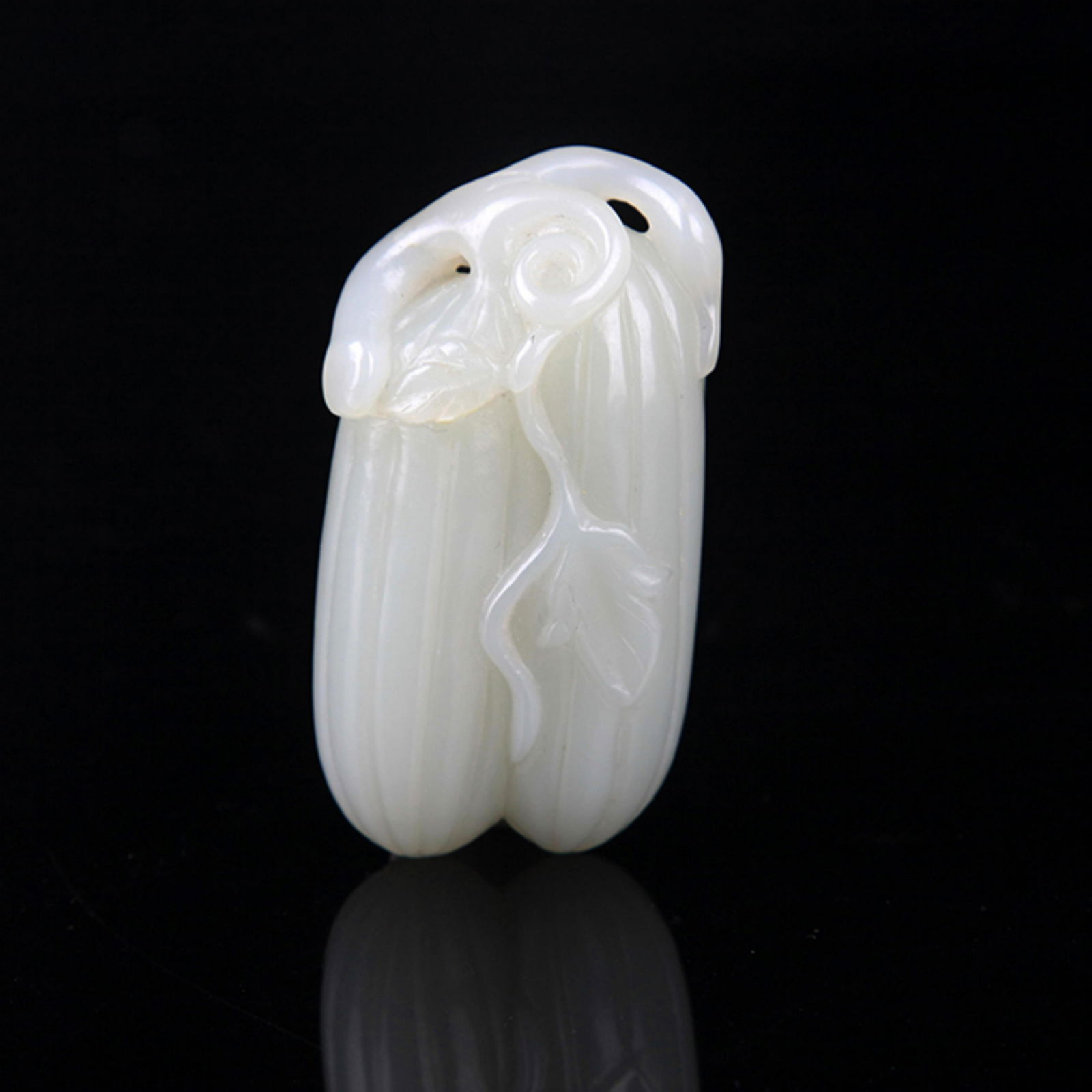 A MELON-SHAPED HETIAN PALE CELADON JADE PENDANT (1 of 4)