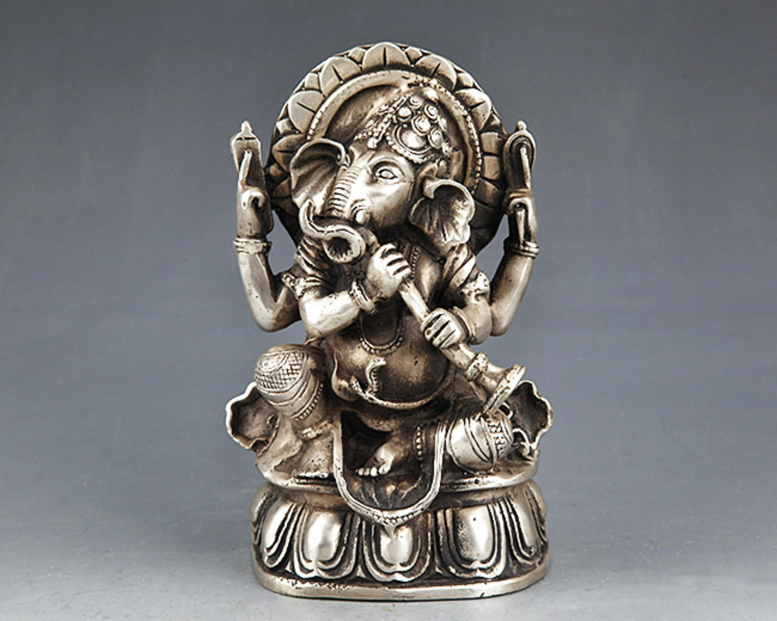 A SMALL AND FINELY CARVED TIBETAN BRONZE BUDDHA: 20th Century, High: 5.75 inch; Width: 3.75 inch