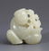 A WHITE JADE PENDANT FIGURE OF "LUCKY BOY"