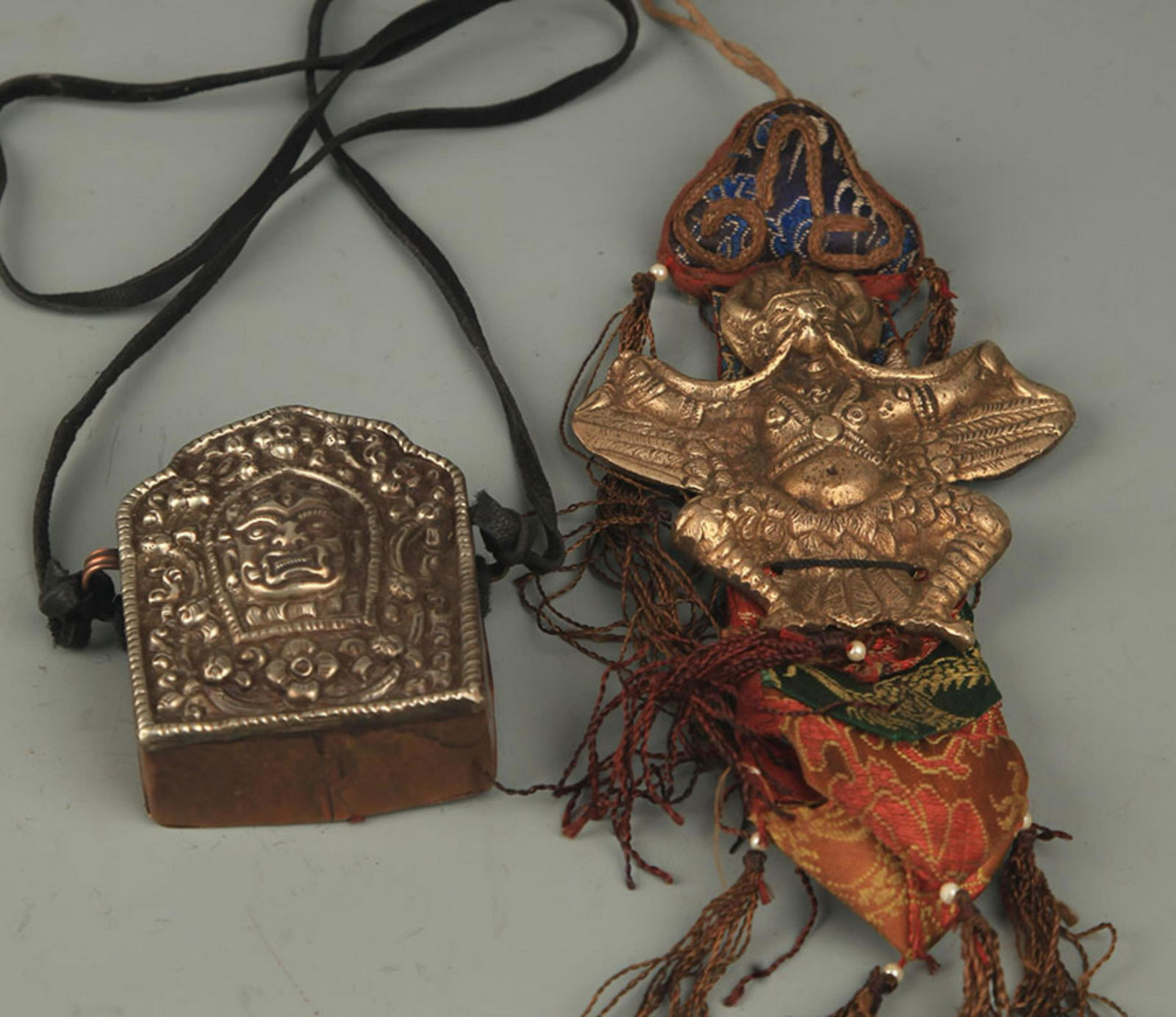 A FINE TIBETAN BUDDHISM GAU AND GARUDA PENDANT (1 of 2)