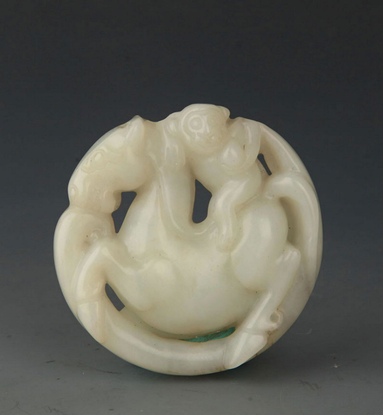 A FINE ROUND JADE IN FIGURE OF HORSE (1 of 3)