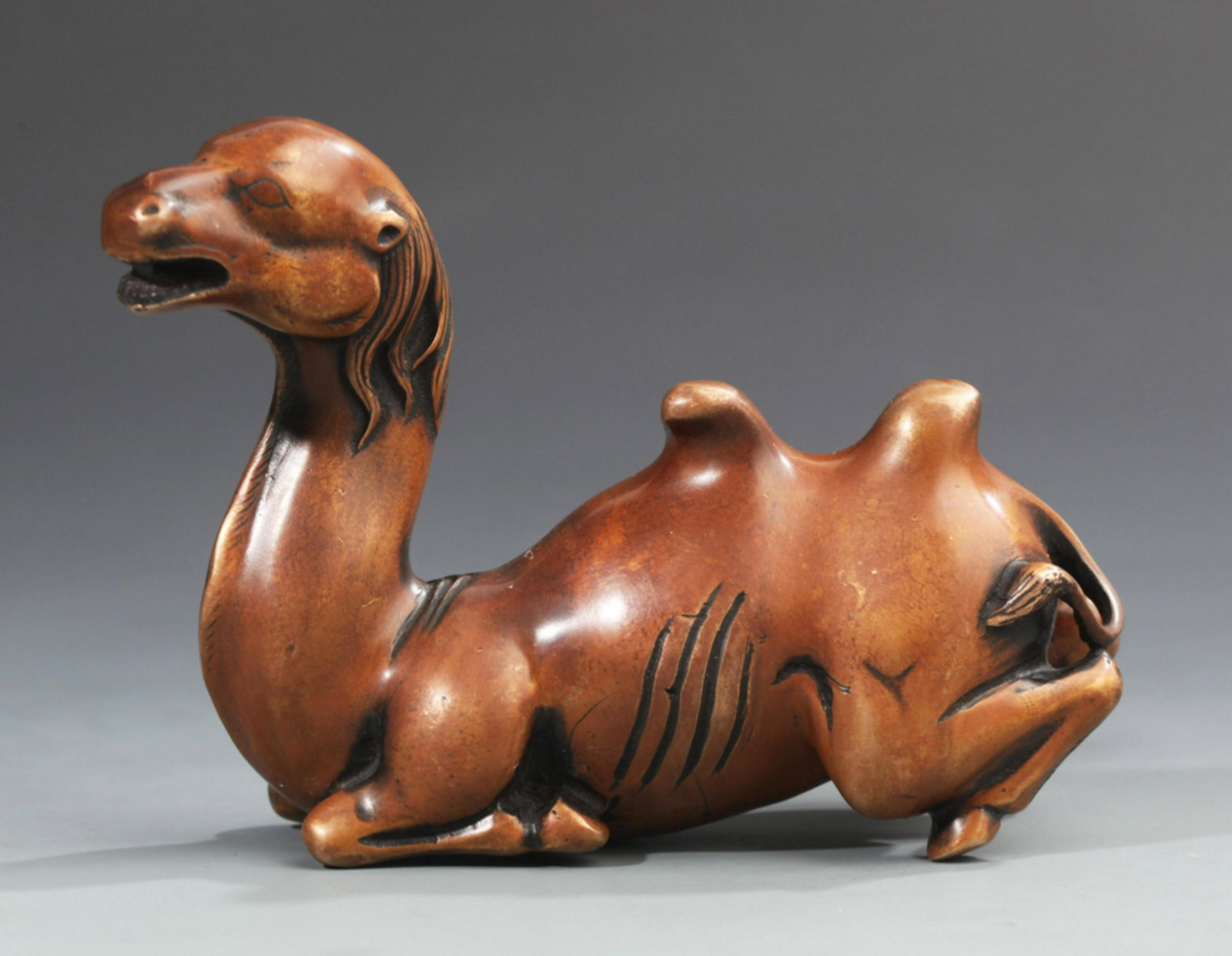 A SMALL BRONZE CAMEL: 20th Century, Long: 5.3 inch Width:2.0 inch High: 3.7 inch