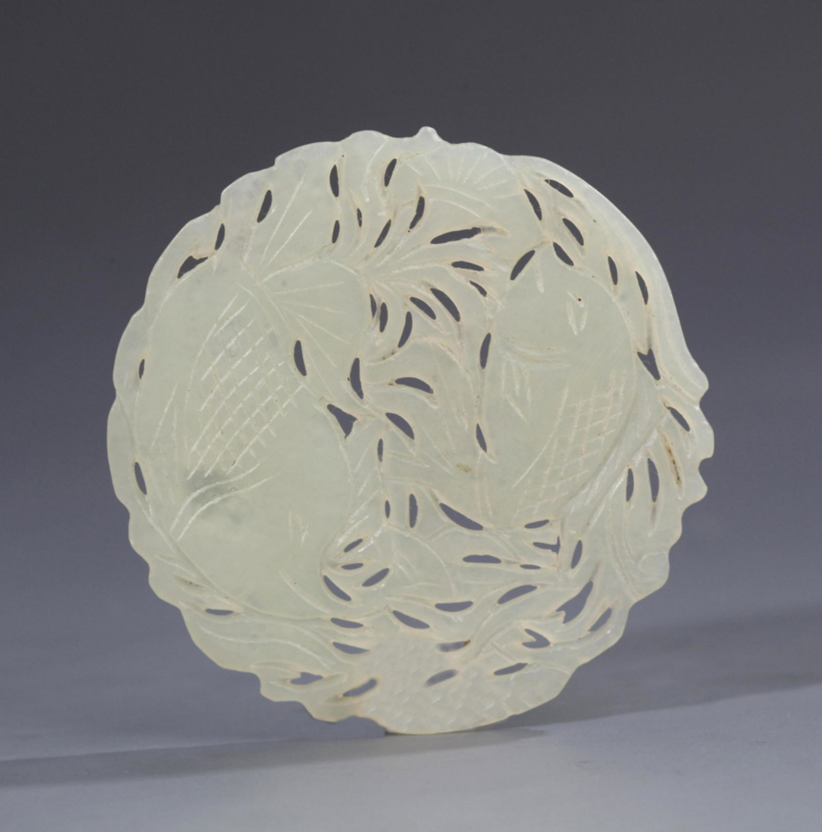 A HOLLOW CARVING FLOWER PATTERN JADE PENDANT (1 of 3)