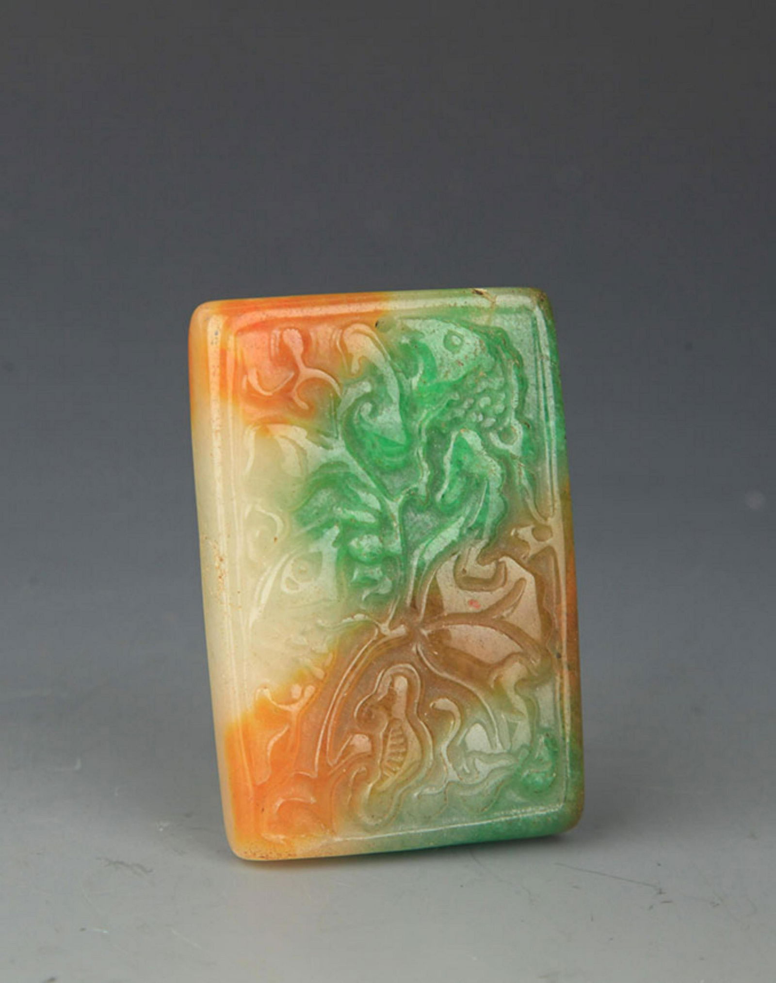 A FINE JADE PENDANT IN FIGURE OF FISH (1 of 3)