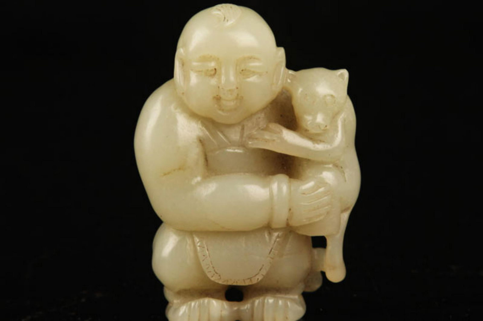A FINE HETIAN JADE IN FIGURE OF BOY AND MONKEY (1 of 4)