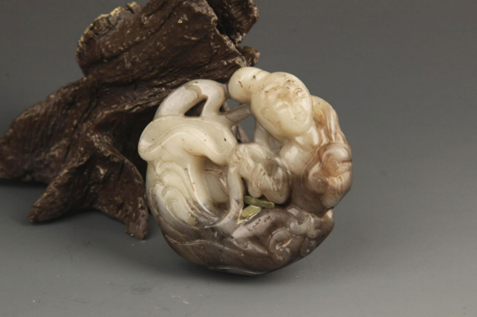A FINE JADE PENDANT IN FIGURE OF IMMORAL (1 of 3)