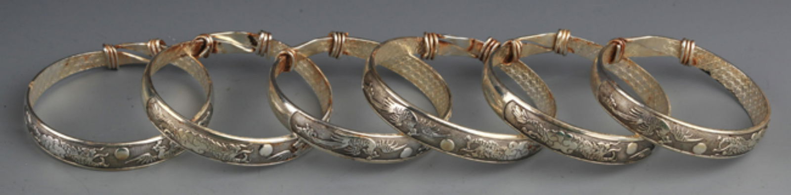 GROUP OF FINELY CARVED SILVER PLATED BANGLES (1 of 4)