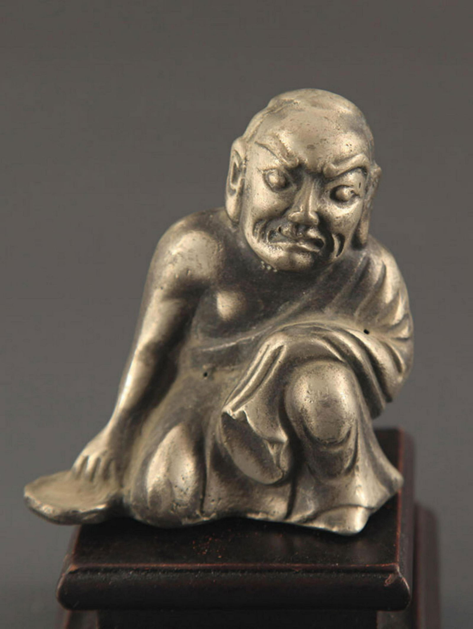 A FINELY MADE BRONZE ARHATS STATUE (1 of 3)