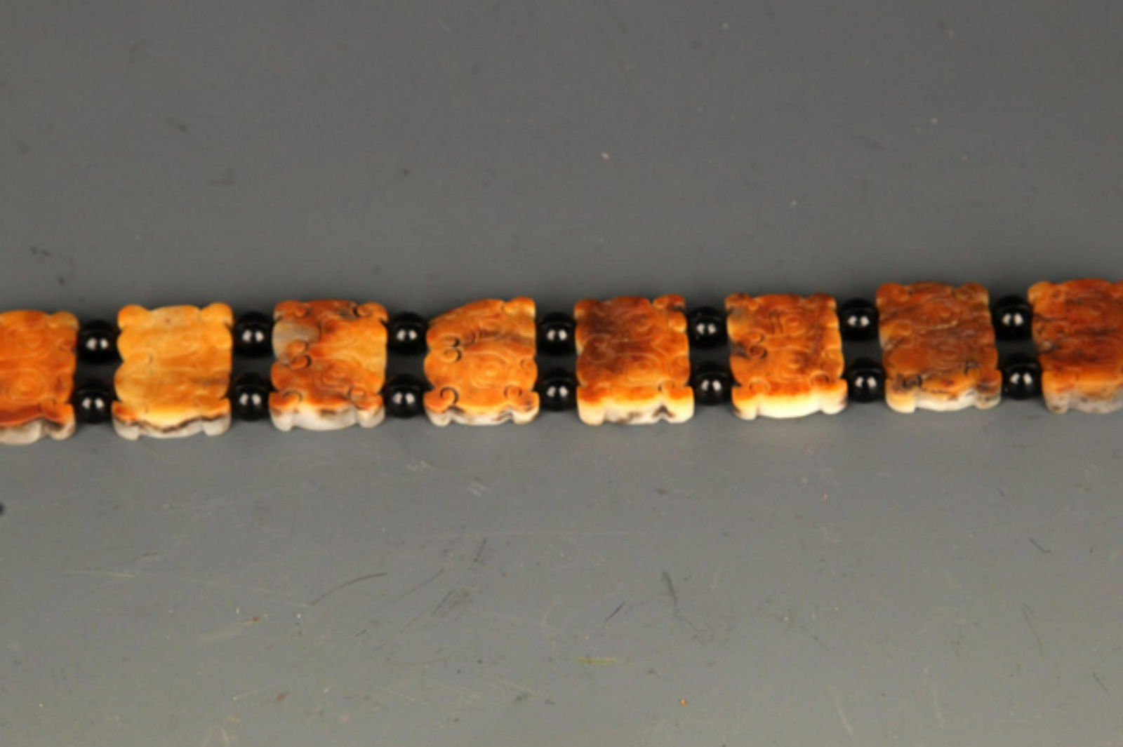 A FINE FINELY CARVED JADE MADE BANGLE (1 of 5)