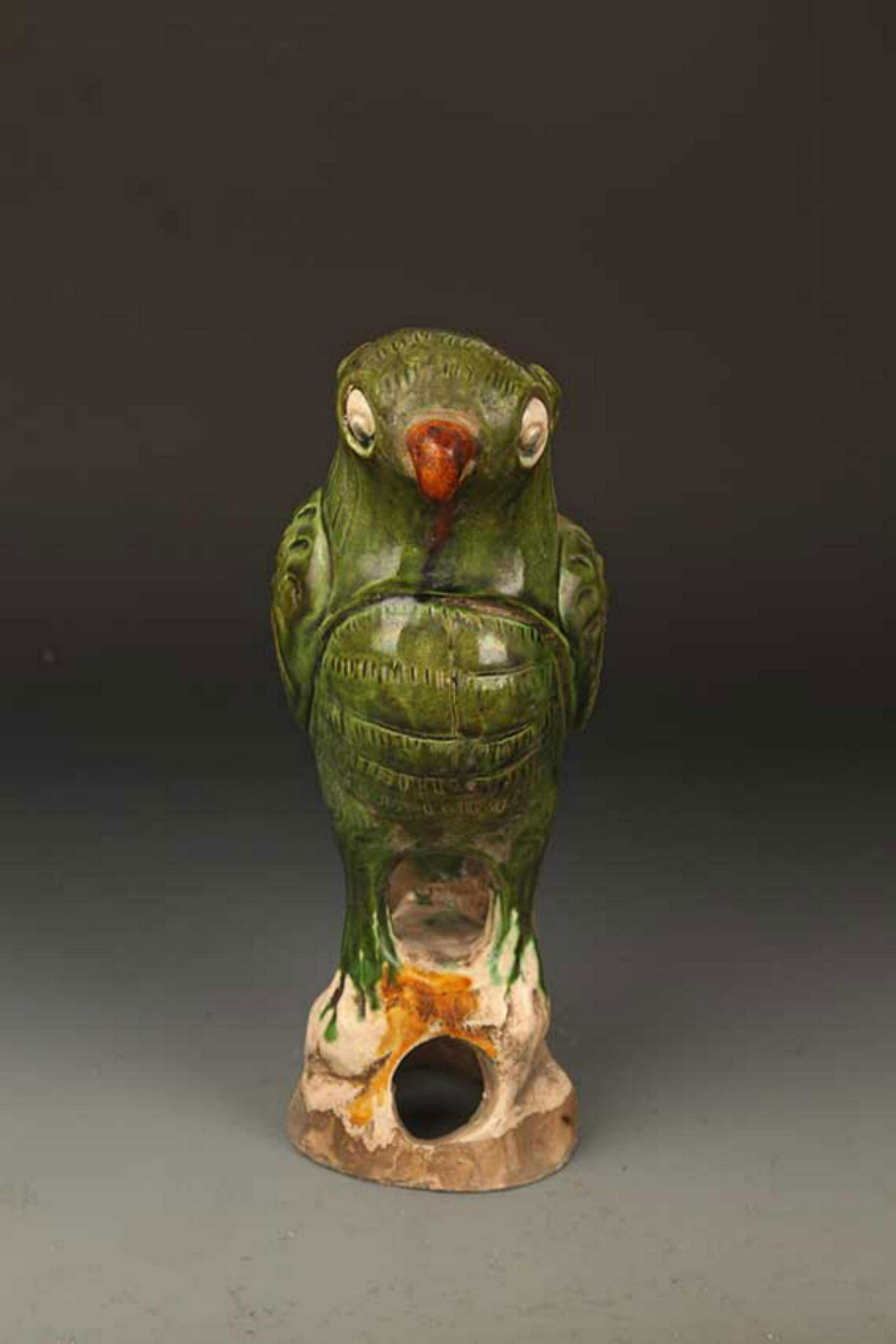 A FINE GREEN GLAZED PARROT FIGURE (1 of 6)