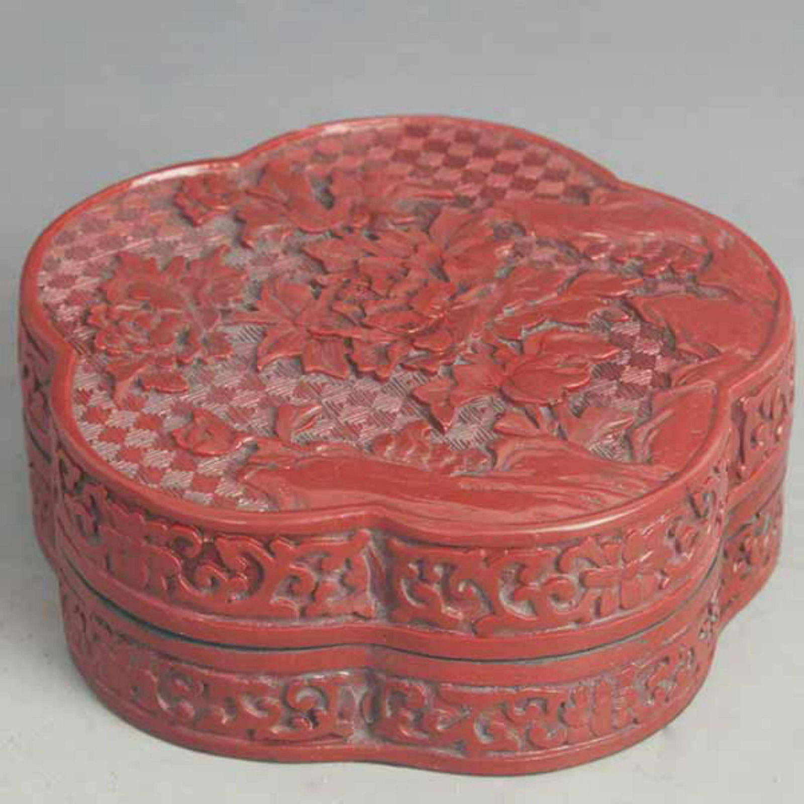 A FINE RED CARVED LACQUER FLOWER PATTERN BOX (1 of 4)