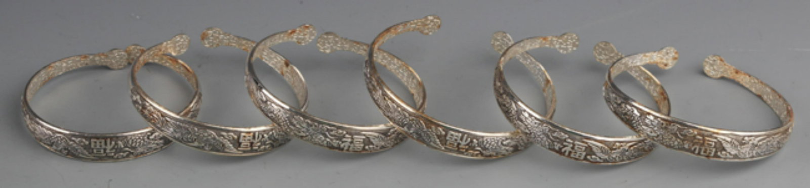GROUP OF FINELY CARVED SILVER PLATED BANGLES (1 of 4)