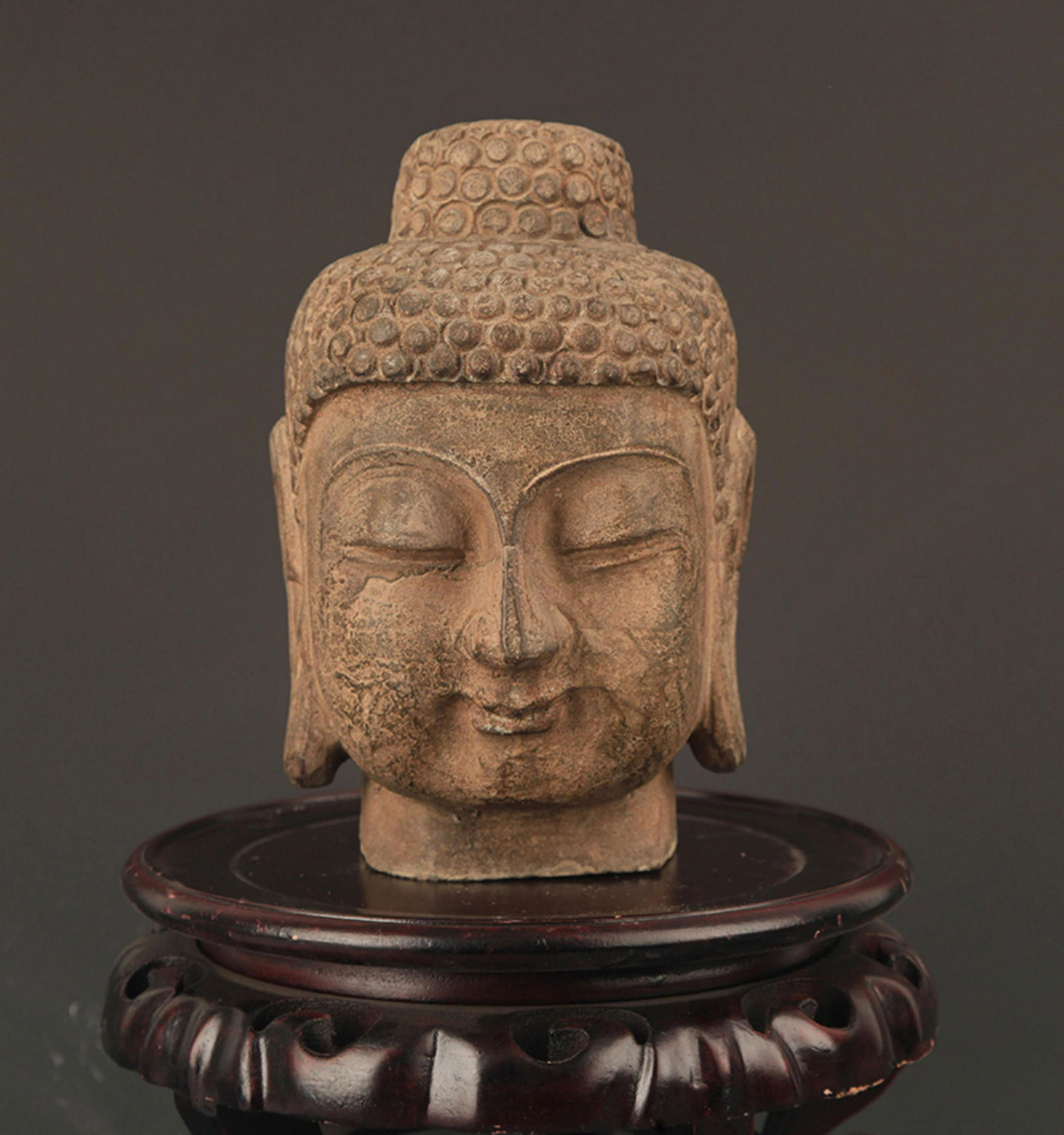 A FINELY CARVED STONE BUDDHA HEAD (1 of 8)