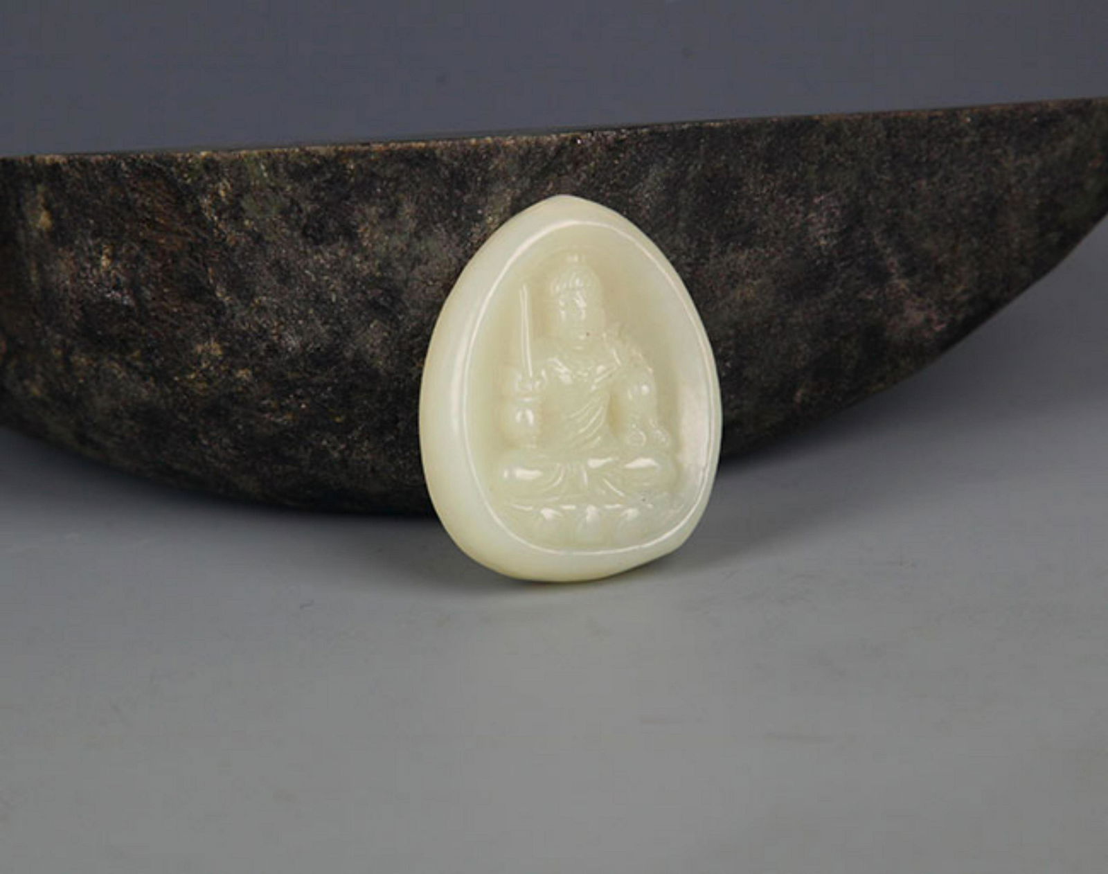 A FINELY CARVED HETIAN PALE CELADON JADE PENDANT: Modern, High:1.5 inch; Width:1.0 inch