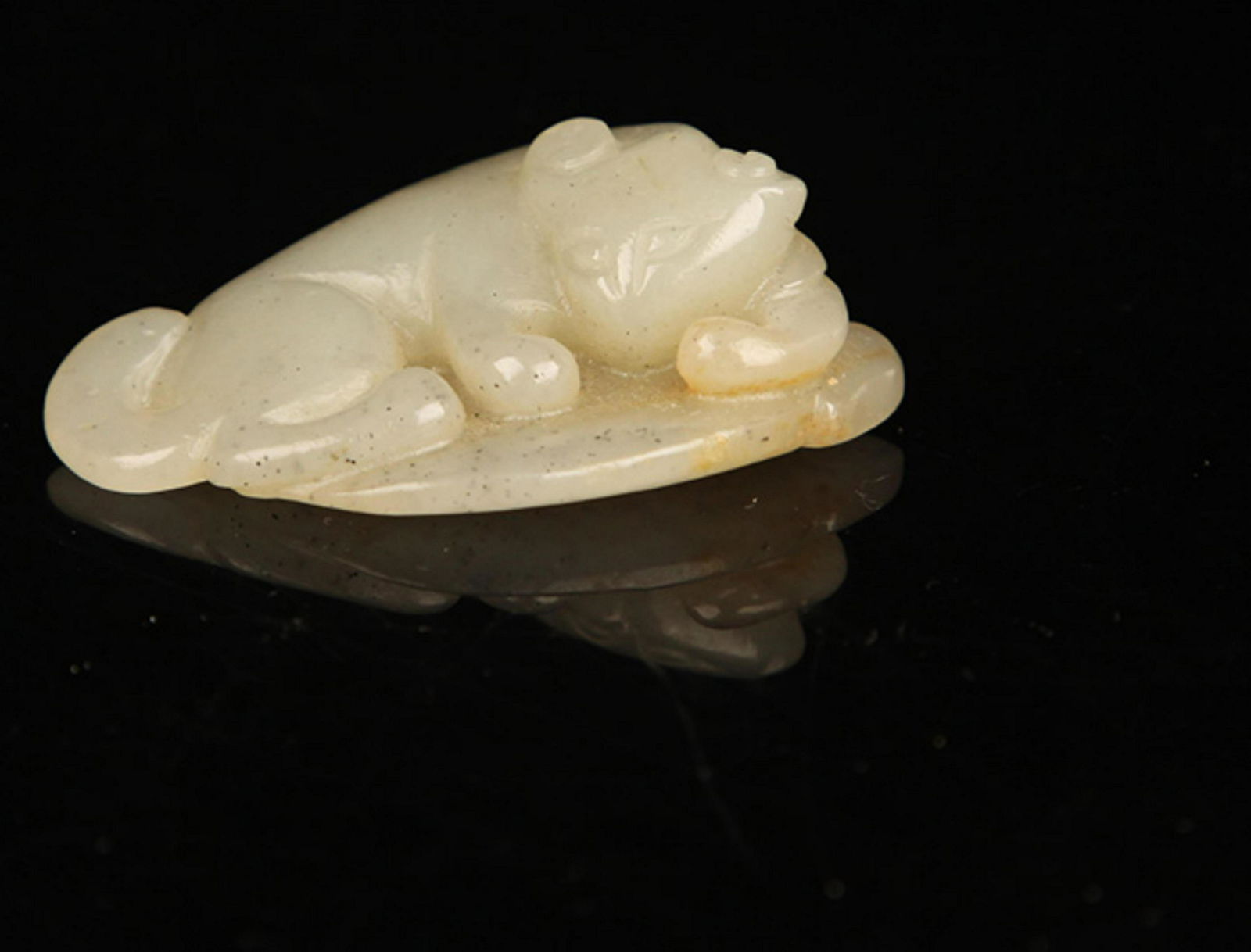 A FINE PALE CELADON JADE IN FIGURE OF RUI SHOU: Qing Dynasty, Long: 1.5 inch; Width: 1.0 inch