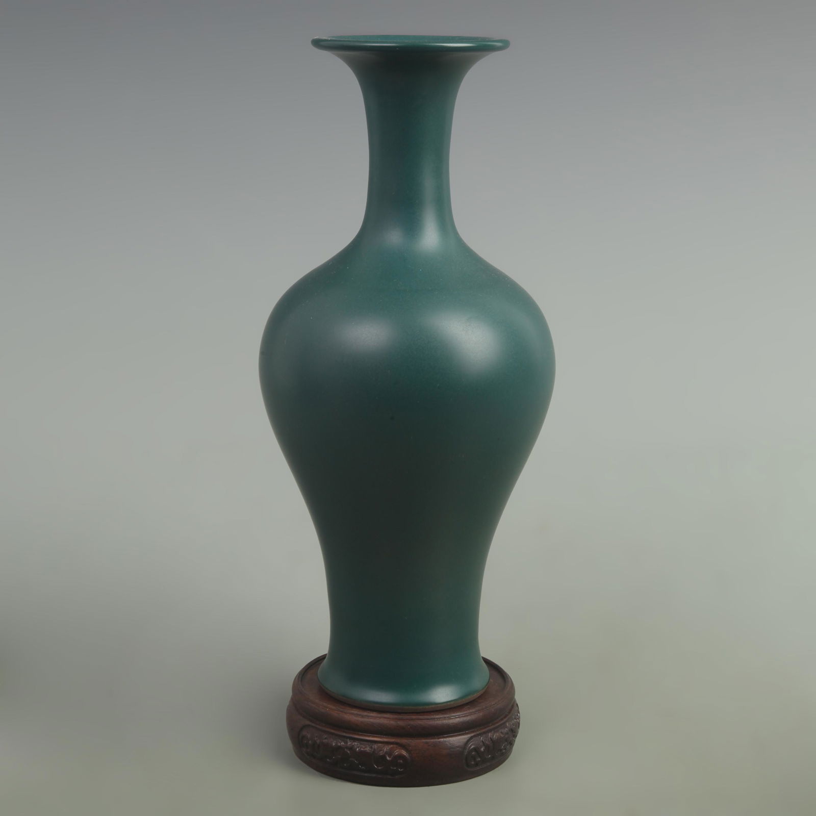 A DARK GREEN GLAZED PORCELAIN BOTTLE (1 of 5)