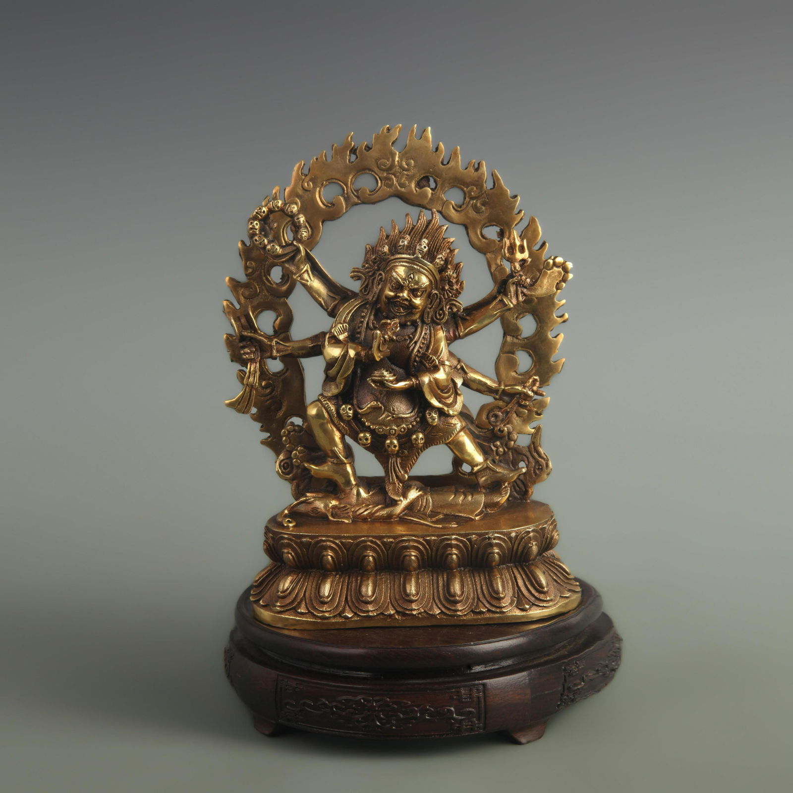 A FINE GILDED BRONZE SIX-ARMED MAHAKALA PROTECTOR STATUE (1 of 5)