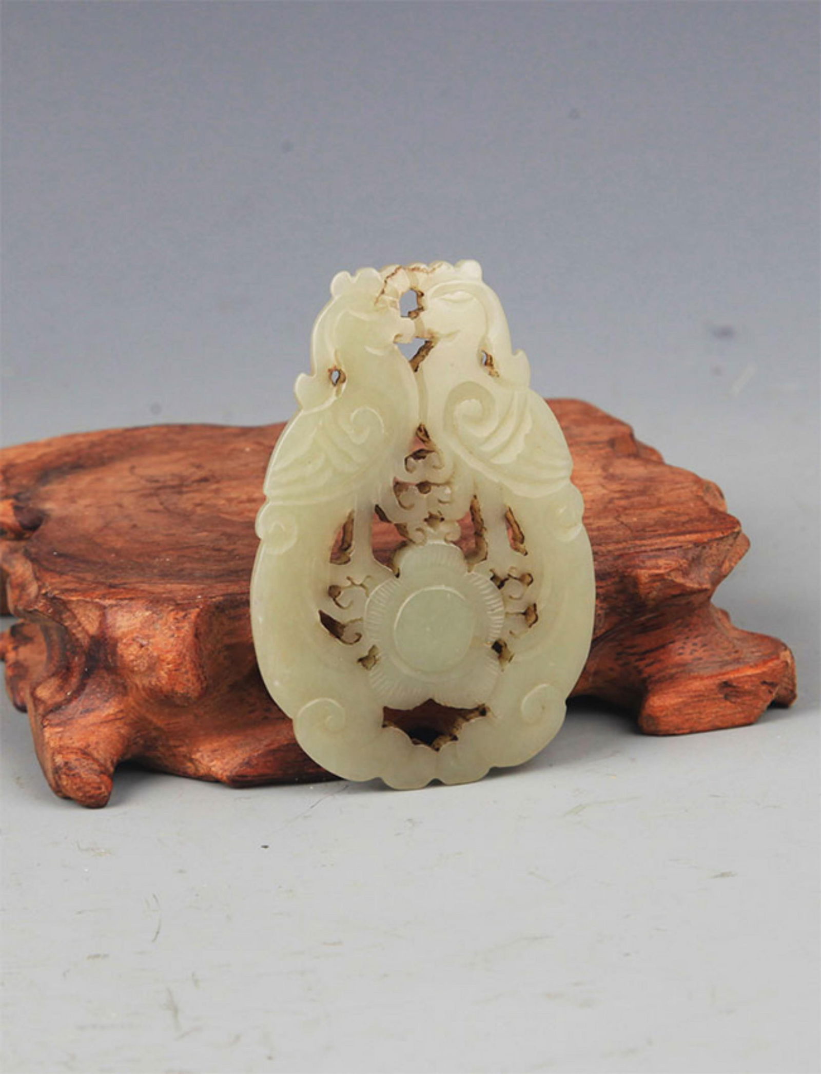 A FINE DOUBLE PHOENIX CARVING PALE CELADON JADE PENDANT (1 of 3)