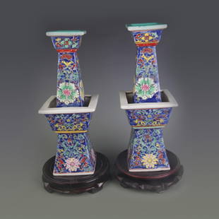 PAIR OF FAMILLE ROSE CANDLE HOLDERS WITH BLUE GROUND AND FLORAL MOTIFS: Qing Dynasty Qian Long Period; High:13.4 inch;