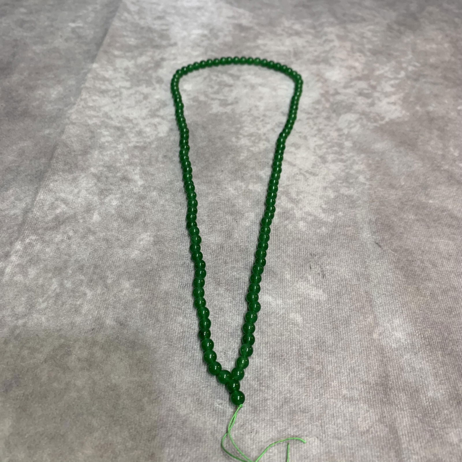A FINE JADE MADE NECKLACE (1 of 2)