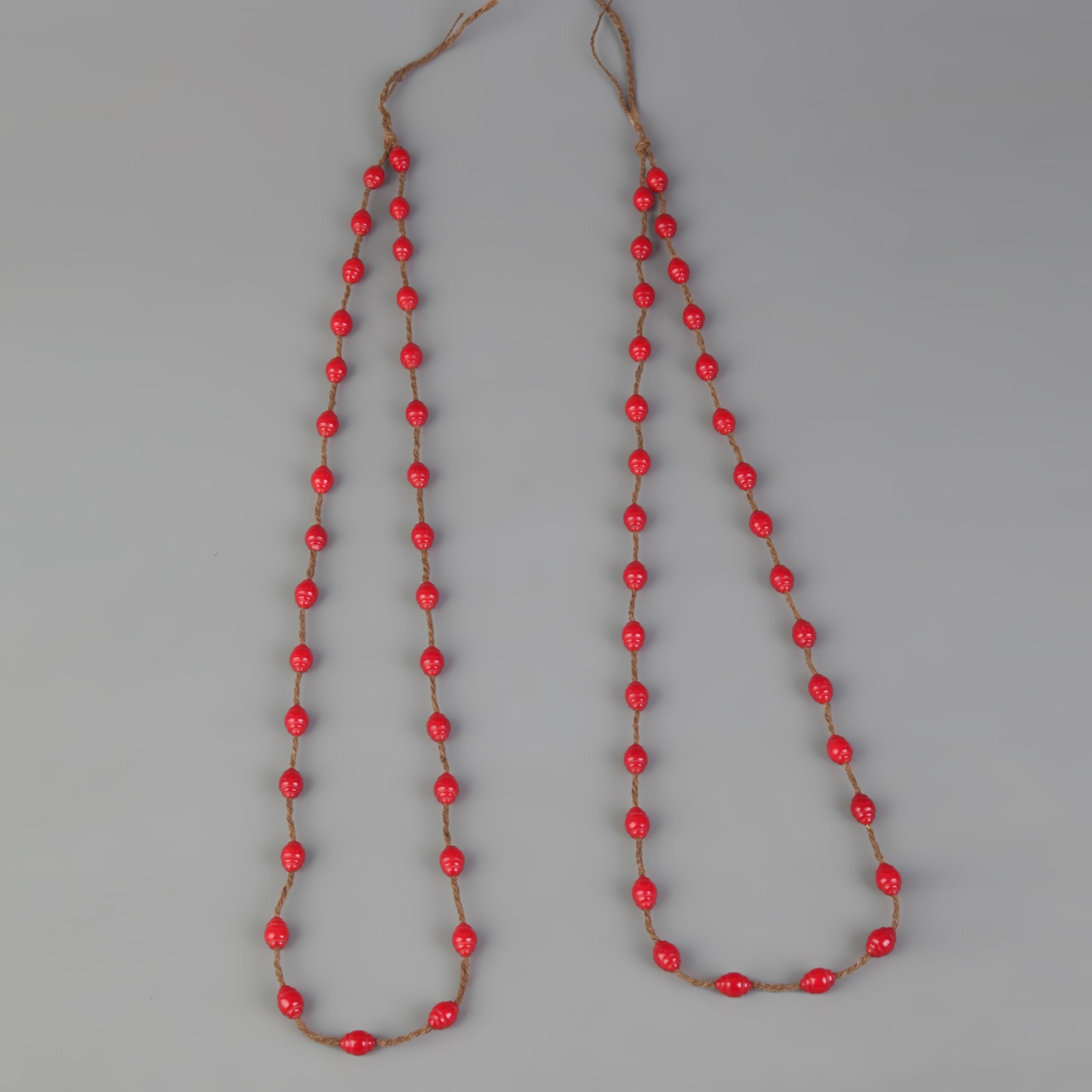 GROUP OF TWO CORAL NECKLACE: 20th Century, Long: 11.5