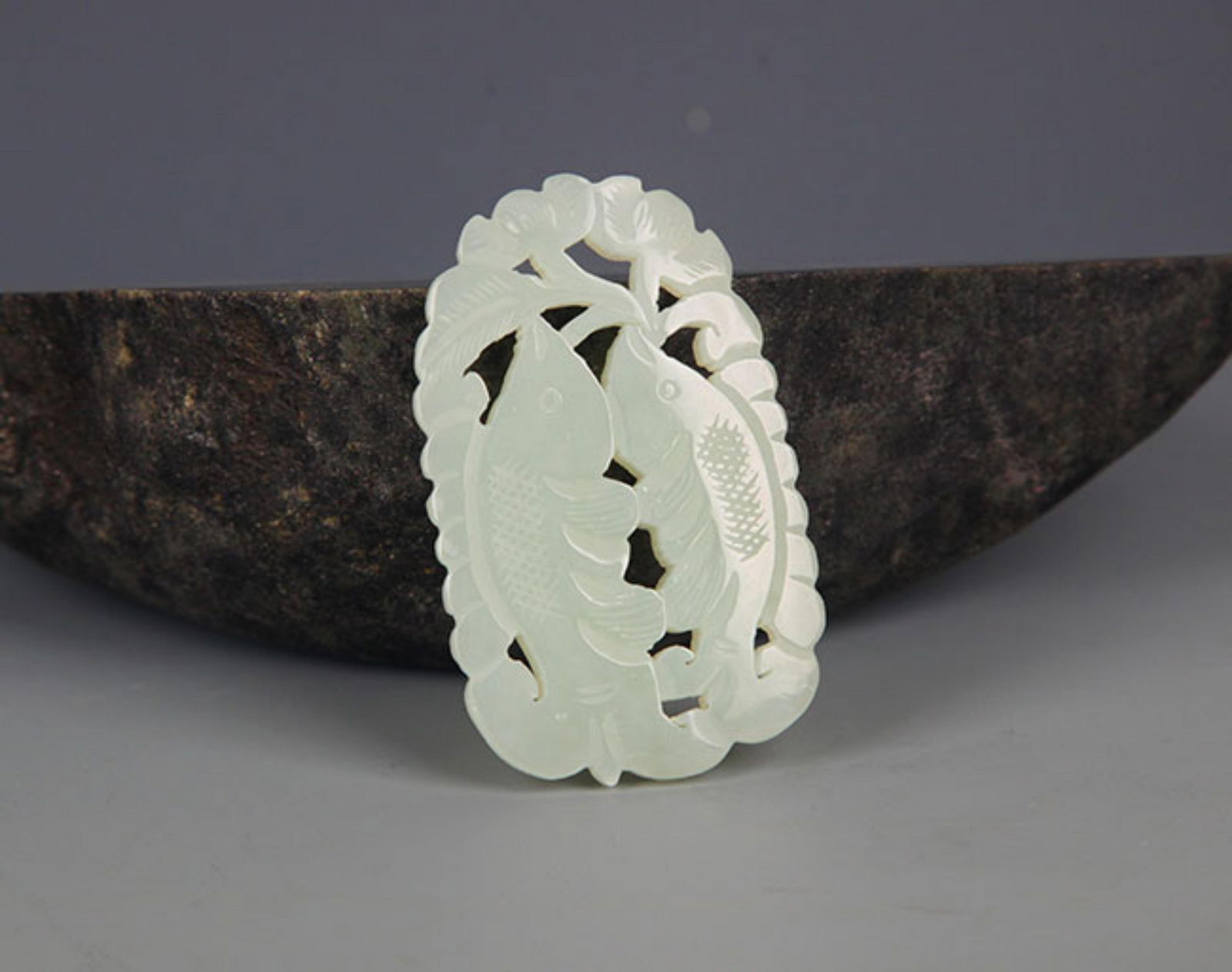 A FINELY CARVED HETIAN PALE CELADON JADE PENDANT PENDANT: Modern, High: 2.2 inch; Width: 1.0 inch;