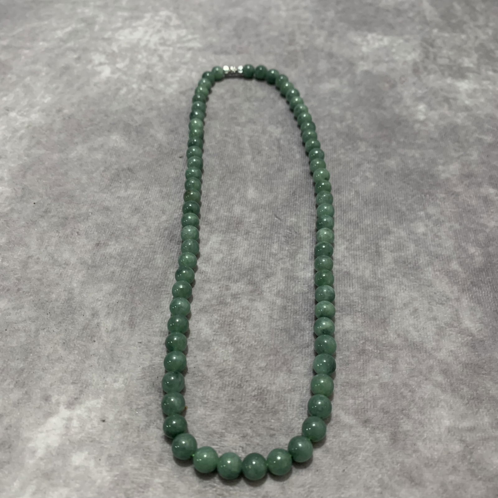 A FINE JADE MADE NECKLACE (1 of 3)