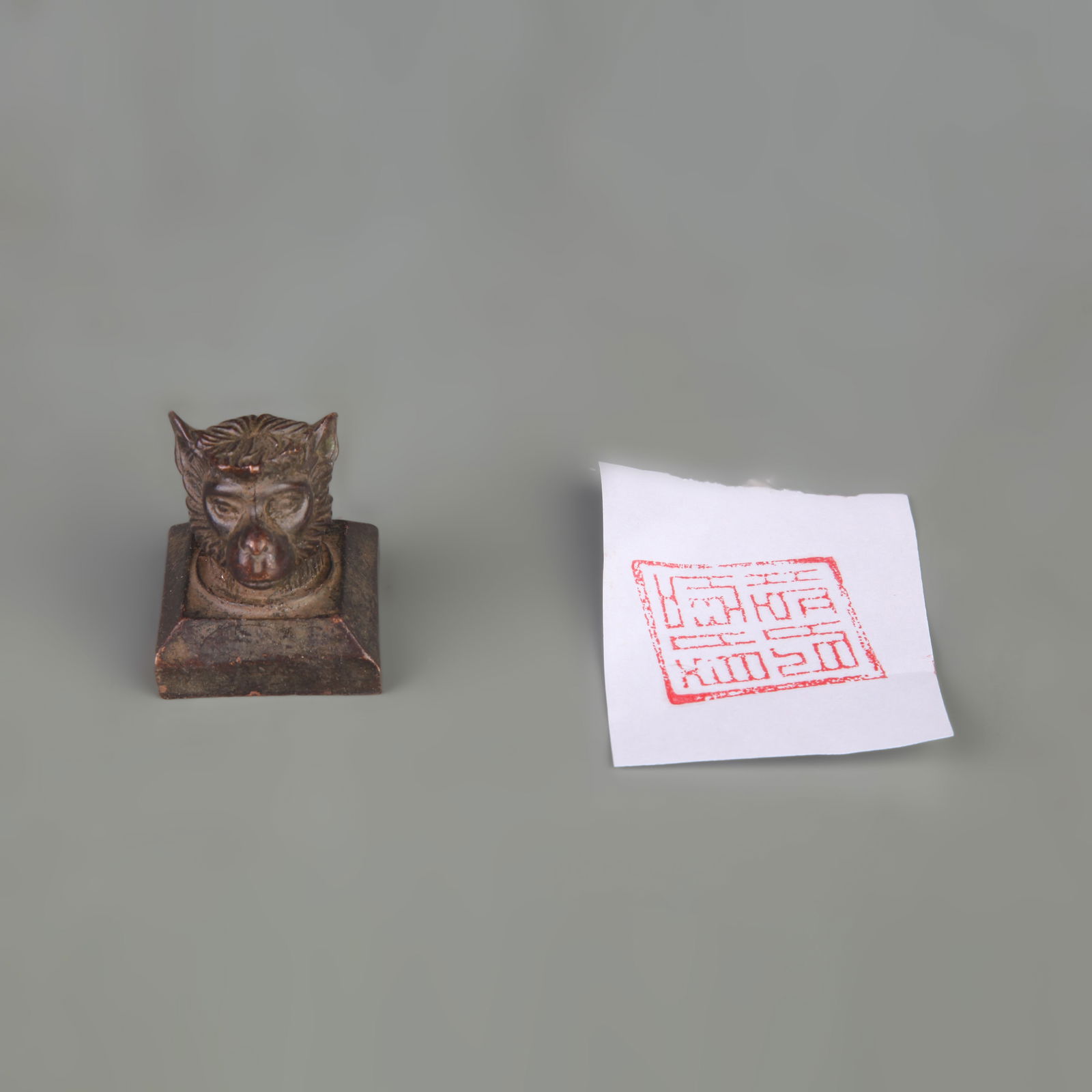 A SMALL BRONZE SQUARE ZODIAC SEAL - MONKEY FIGURE (1 of 7)
