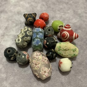 GROUP OF GLASS MADE BEADS