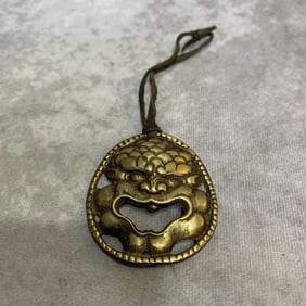 A FINE TIBETAN BUDDHIST RITUAL PENDANT