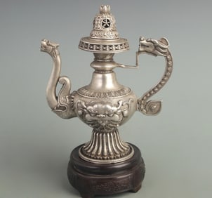 A FINELY CARVED ANIMAL PATTERN WHITE BRONZE EWER