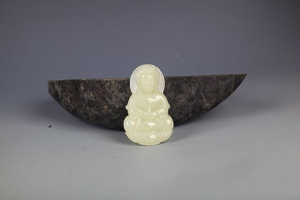 A FINELY CARVED HETIAN JADE IN FIGURE OF GUANYIN