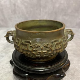 A FINELY CARVED ELEPHANT EAR PATTERN BRONZE CENSER