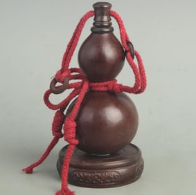 A FINE CARVED GOURD MADE VASE