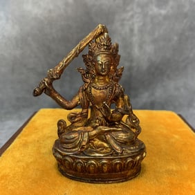 A SMALL BRONZE MANJUSRI BUDDHA STATUE