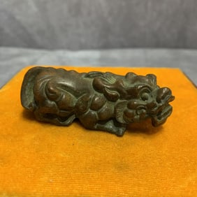 A SMALL BRONZE RUI SHOU FIGURE