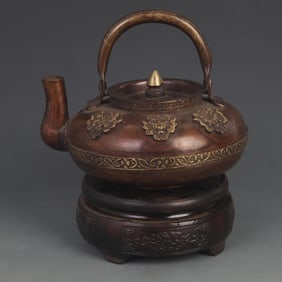 A FINE TIBETAN BUDDHIST FINELY CARVED BRONZE EWER