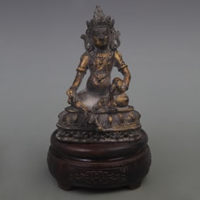A FINE BRONZE YELLOW GOD OF WEALTH STATUE